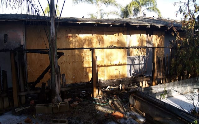 Fire and smoke damage restoration crew at a commercial building