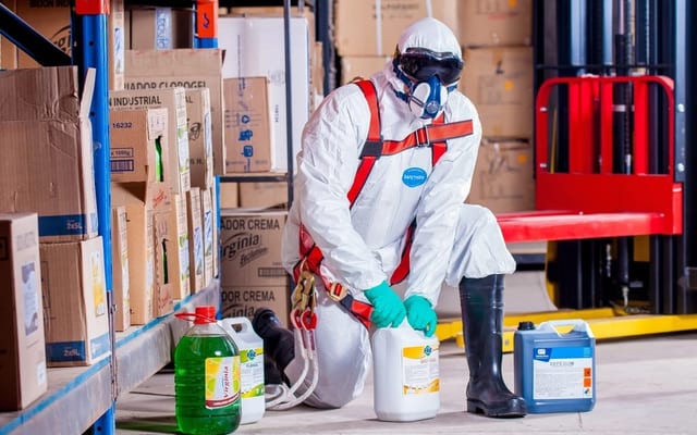 Infectious disease cleanup specialists in protective gear