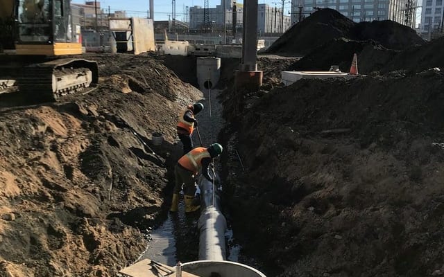 Sewage backup cleanup specialists in protective equipment
