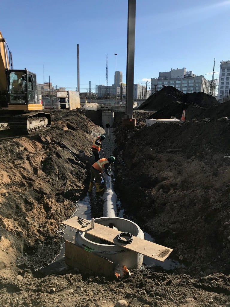 Sewage backup cleanup specialists in protective equipment